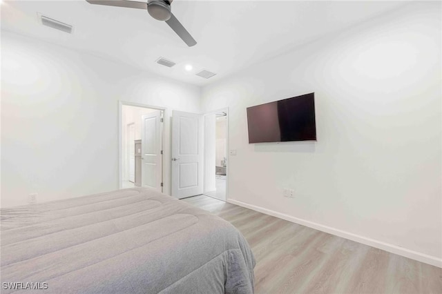 bedroom with light hardwood / wood-style flooring and ceiling fan