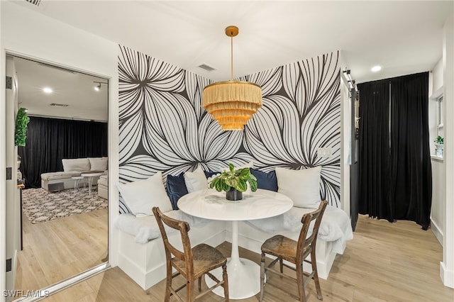 dining room with light hardwood / wood-style flooring