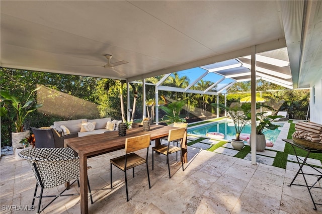 view of patio / terrace with a lanai, outdoor lounge area, and ceiling fan