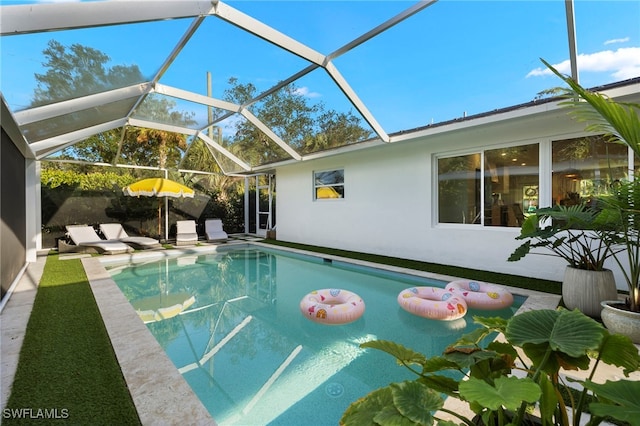 view of pool featuring a lanai