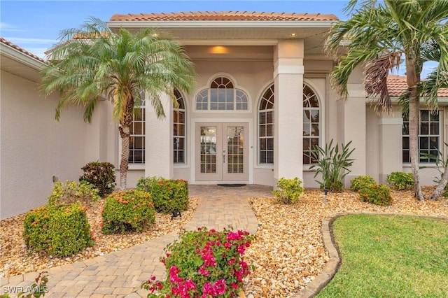 property entrance featuring french doors