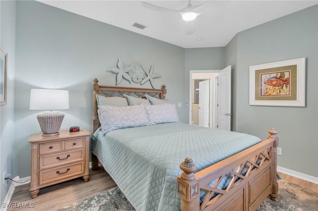 bedroom with ceiling fan and light hardwood / wood-style flooring