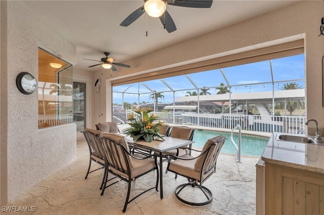 exterior space featuring ceiling fan and sink