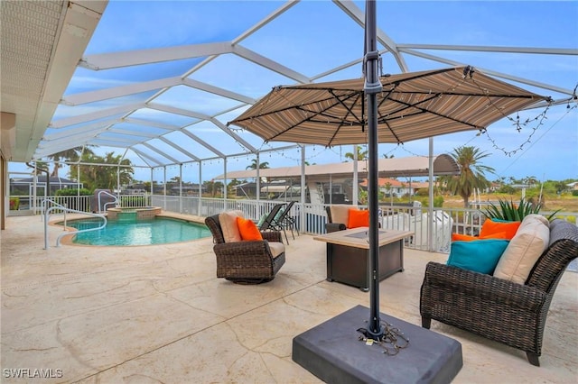 view of pool with a lanai, an in ground hot tub, a patio, and an outdoor living space