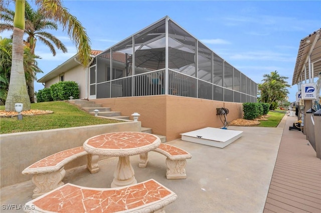 view of patio / terrace with glass enclosure