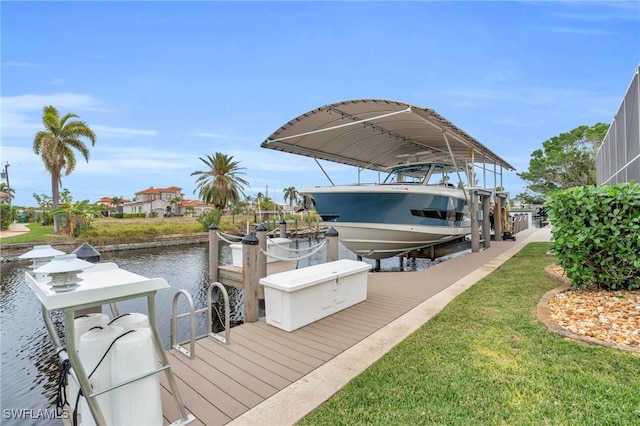 dock area with a water view and a yard