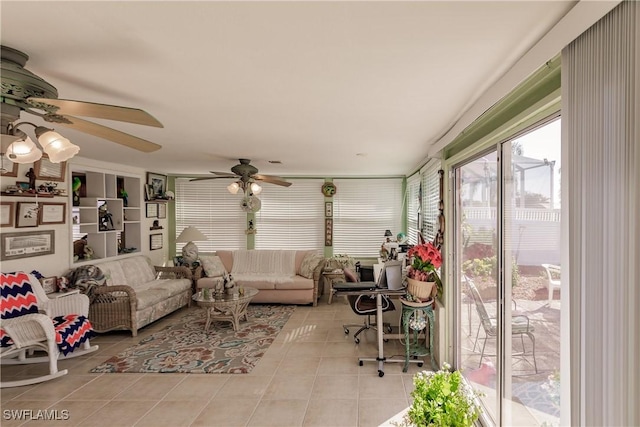 sunroom featuring ceiling fan