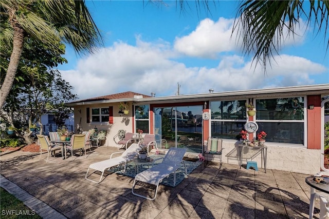 back of house with a patio area