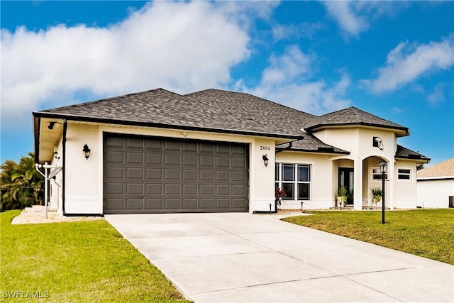 view of front facade featuring a garage and a front lawn