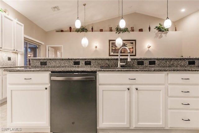 kitchen with stainless steel dishwasher, pendant lighting, and vaulted ceiling