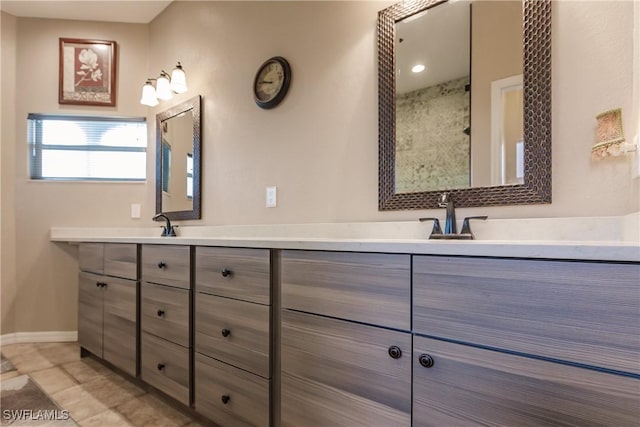 bathroom featuring tile patterned flooring and vanity