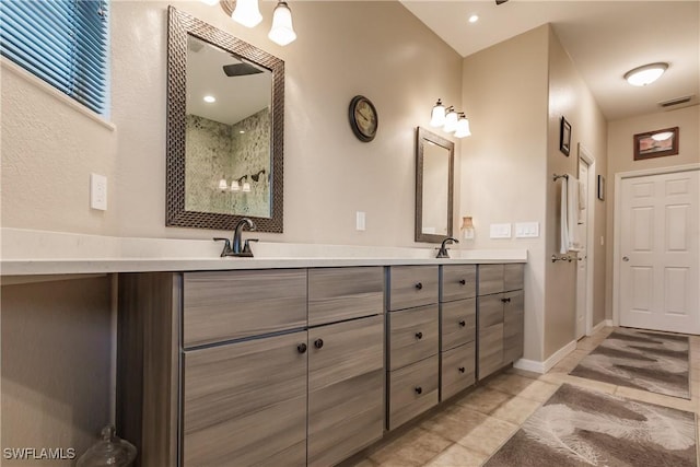 bathroom featuring tile patterned flooring and vanity