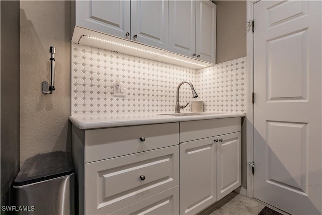 clothes washing area with sink