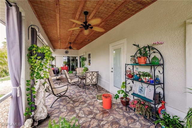 view of patio featuring ceiling fan