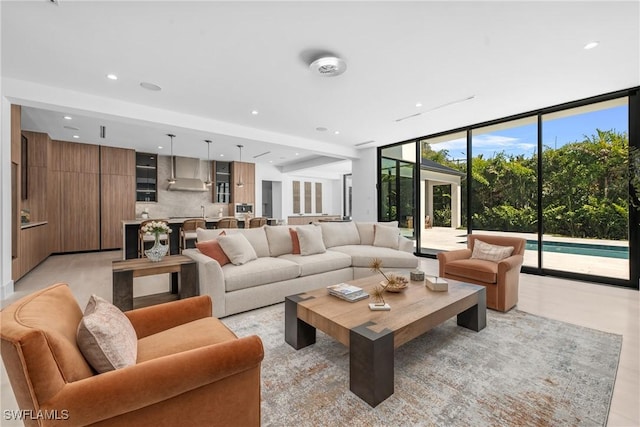 living area with recessed lighting and expansive windows
