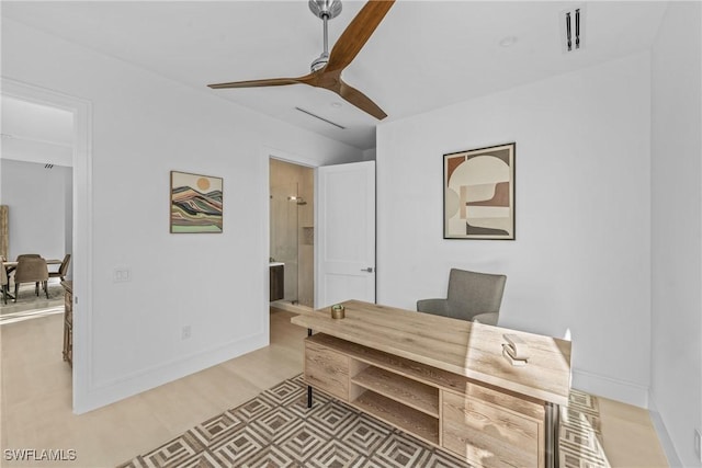office with baseboards, light wood finished floors, and ceiling fan