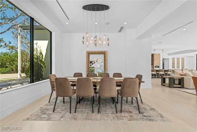 dining area featuring recessed lighting, an inviting chandelier, and visible vents