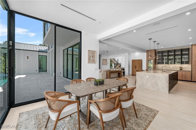dining room featuring expansive windows and recessed lighting