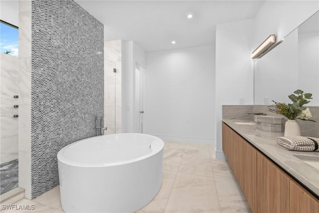 full bath with double vanity, tiled shower, a freestanding tub, marble finish floor, and recessed lighting
