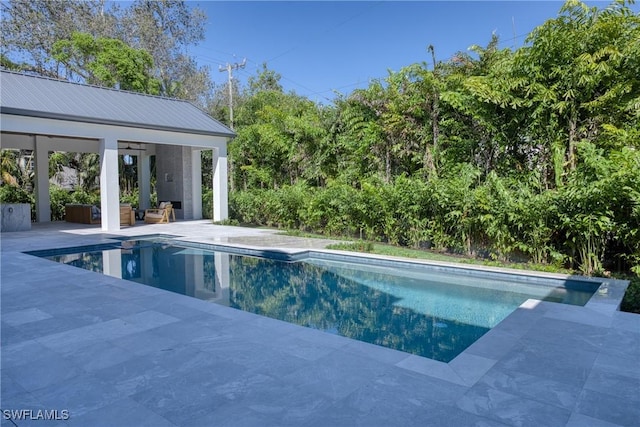 pool featuring a gazebo and a patio