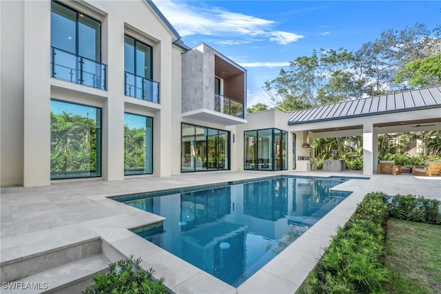 outdoor pool featuring a patio area