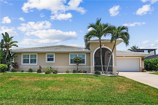 view of front of home with a front lawn and a garage