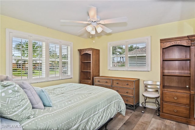 bedroom featuring ceiling fan and light hardwood / wood-style flooring