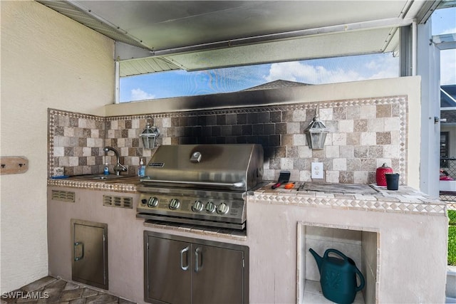 kitchen with tasteful backsplash and sink