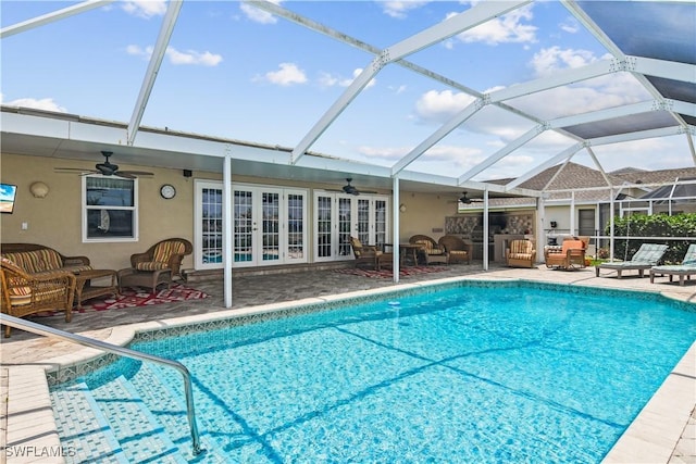 view of pool featuring french doors, an outdoor hangout area, and a lanai