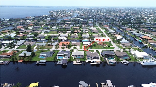 birds eye view of property featuring a water view