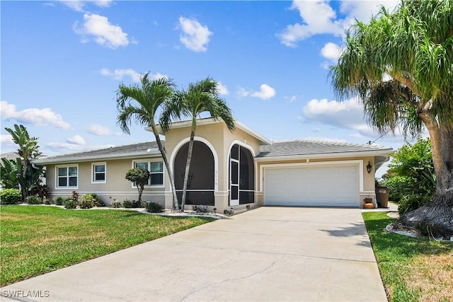 view of front facade with a garage and a front lawn