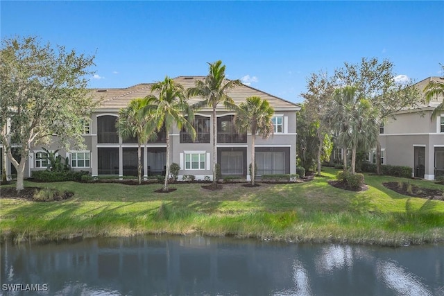 rear view of house with a water view