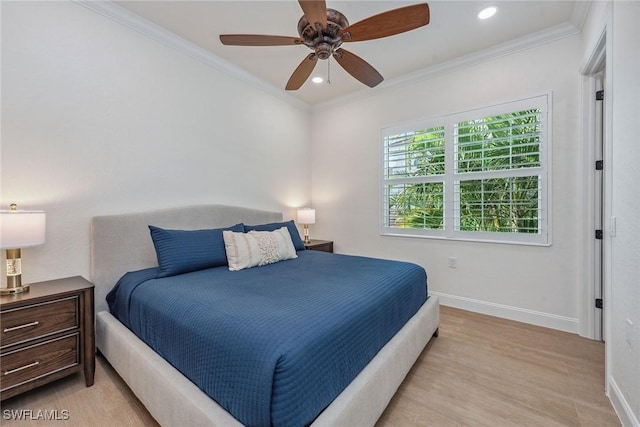 bedroom featuring ceiling fan, light wood-type flooring, and ornamental molding