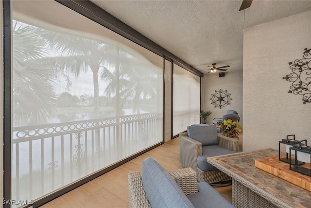 sunroom / solarium with ceiling fan