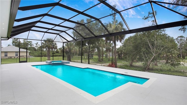 view of swimming pool featuring an in ground hot tub, glass enclosure, and a patio area