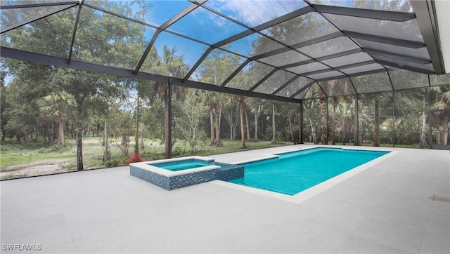 view of swimming pool featuring an in ground hot tub, a patio, and a lanai