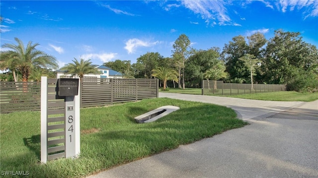 view of home's community with a yard