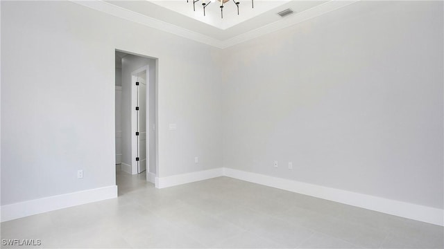 unfurnished room with crown molding