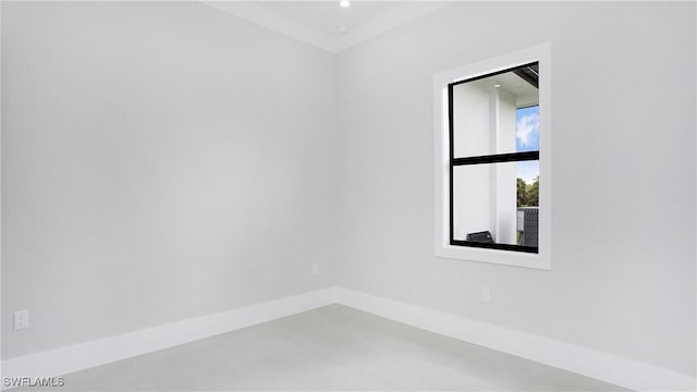 spare room with ornamental molding