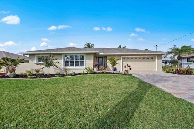 ranch-style house featuring a front yard and a garage