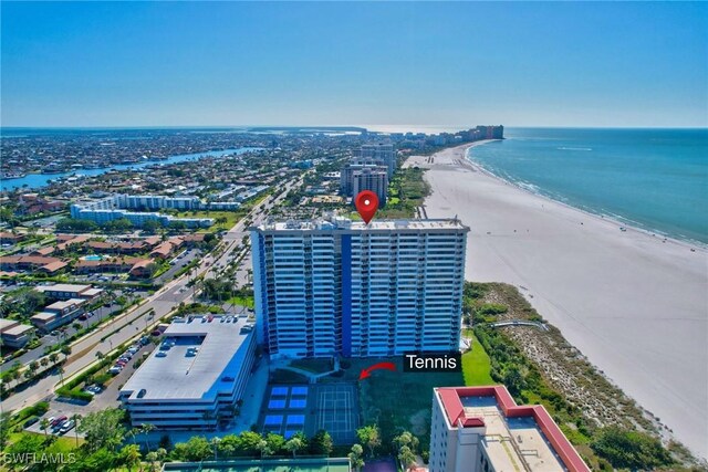 bird's eye view featuring a beach view and a water view