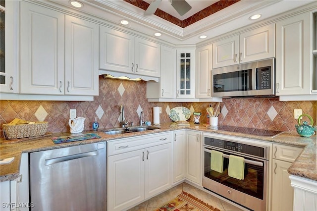 kitchen with sink, white cabinets, and appliances with stainless steel finishes