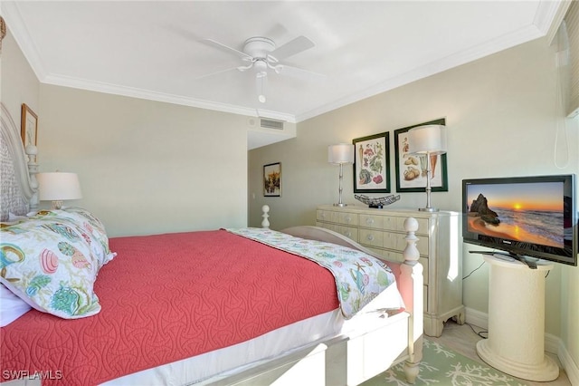 bedroom featuring ceiling fan and ornamental molding