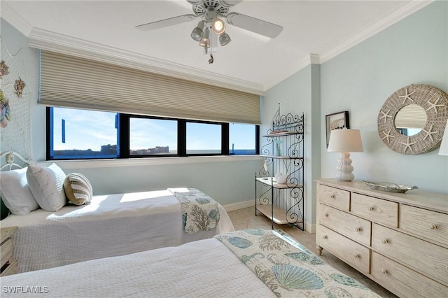 bedroom with ceiling fan and ornamental molding