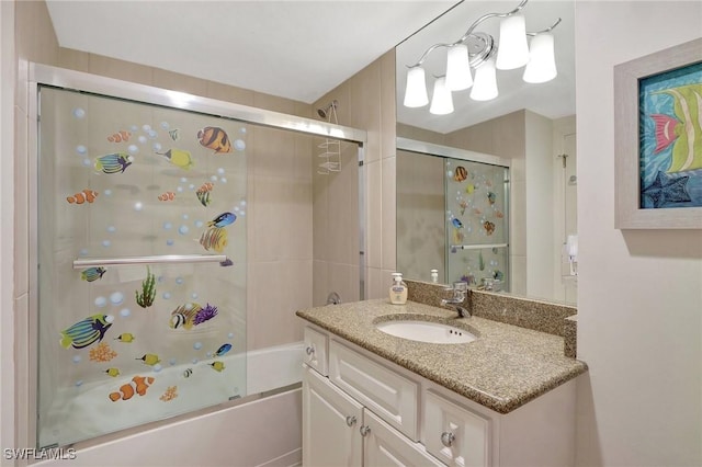 bathroom with shower / bath combination with glass door and vanity