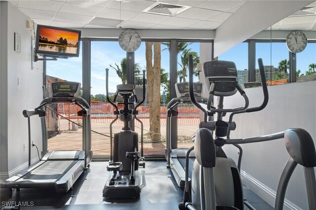 workout area with a paneled ceiling