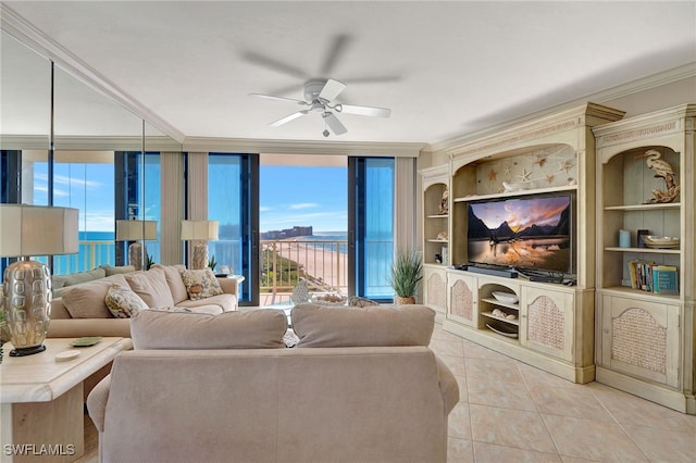 living room with a water view, ceiling fan, ornamental molding, light tile patterned floors, and floor to ceiling windows