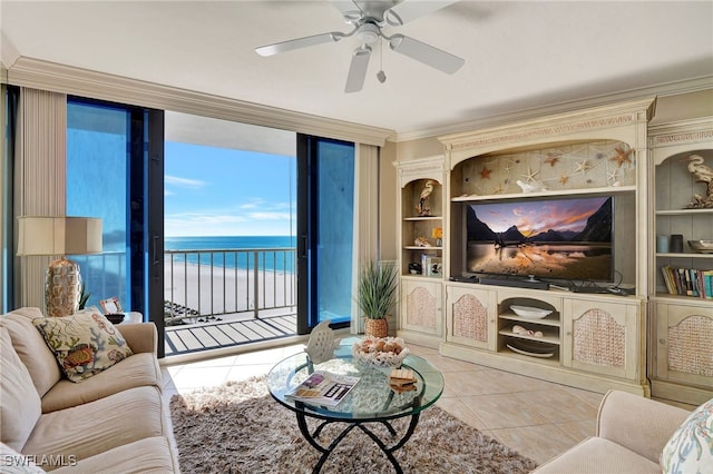 tiled living room featuring ceiling fan and ornamental molding