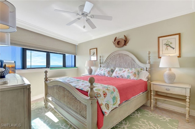 bedroom with ceiling fan and crown molding