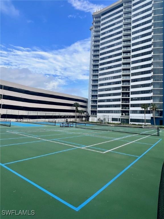 view of tennis court featuring basketball court